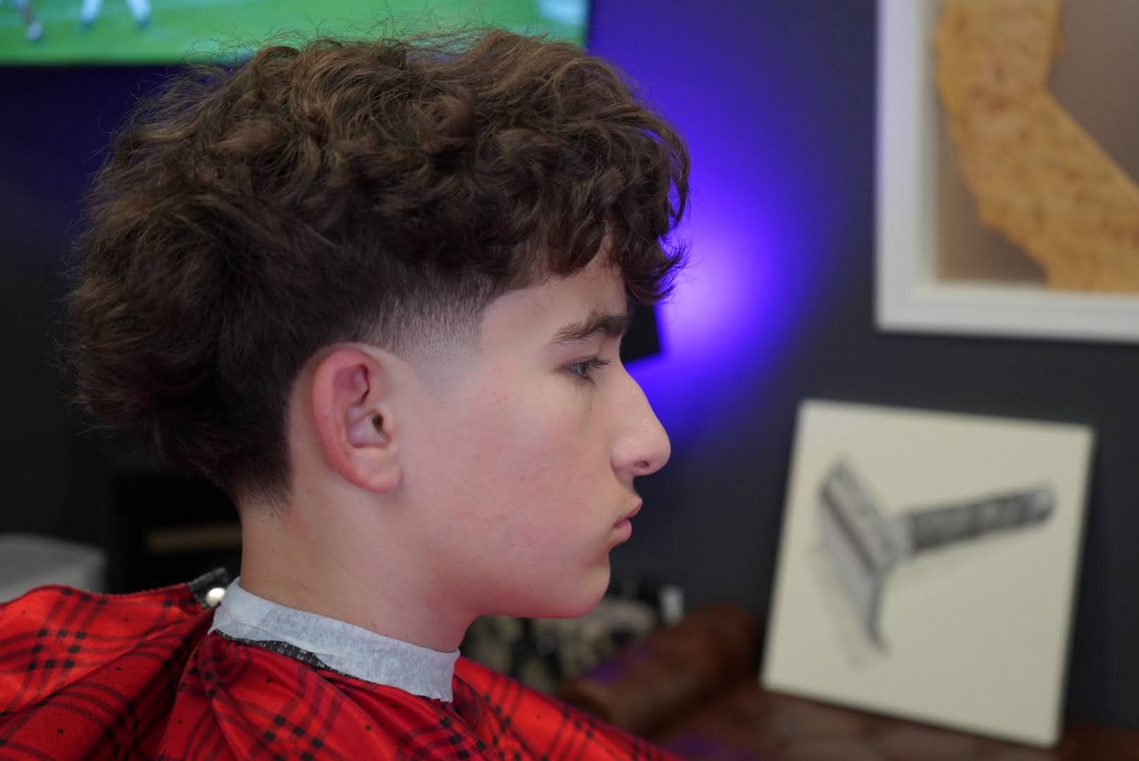 Curly top with a low taper fade