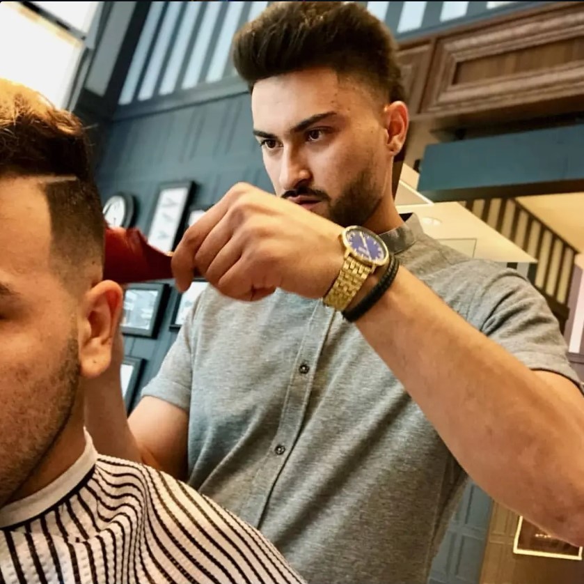 Juan focused on a detail cut at the chair